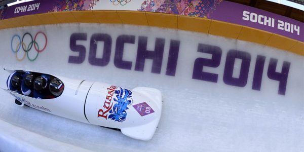 FILES) This file photo taken on February 23, 2014 shows Gold Medallist, Russia-1 four-man bobsleigh, pilot Alexander Zubkov, pushman Alexey Negodaylo, pushman Dmitry Trunenkov and brakeman Alexey Voevoda competing in the Bobsleigh Four-man Heat 4 and final run at the Sanki Sliding Center during the Sochi Winter Olympics. Two more Russian bobsleighers from the Russian-hosted 2014 Sochi Winter Olympics, Trunenkov and Negodaylo, have been stripped of their gold medals for do