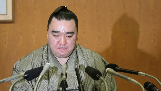 Mongolian-born yokozuna, or grand champion, Harumafuji bites his lips at a press conference to announce his retirement in Dazaifu, Fukuoka prefecture on November 29, 2017. Japan's ancient sport of sumo suffered another humiliating blow on November 29 when grand champion Harumafuji retired to atone for a brutal assault on a rival wrestler while out drinking.