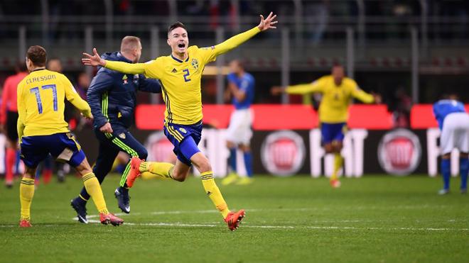 Sweden's defender Mikael Lustig celebrates at the end of the FIFA World Cup 2018 qualification football match between Italy and Sweden, on November 13, 2017 at the San Siro stadium in Milan. Italy failed to reach the World Cup for the first time since 1958 on Monday as they were held to a 0-0 draw in the second leg of their play-off at the San Siro by Sweden, who qualified with a 1-0 aggregate victory.