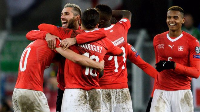 Swiss players celebrates their qualification at the end of the FIFA 2018 World Cup play-off second leg football match between Switzerland and Northern Ireland at St. at St. Jakob-Park Stadium on November 12, 2017. Fabrice COFFRINI / AFP