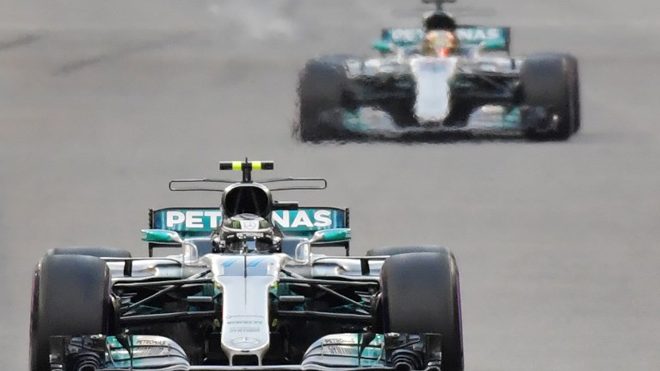 Mercedes' Finnish driver Valtteri Bottas steers his car followed by Mercedes' British driver Lewis Hamilton during the Abu Dhabi Formula One Grand Prix at the Yas Marina circuit on November 26, 2017. Giuseppe CACACE / AFP