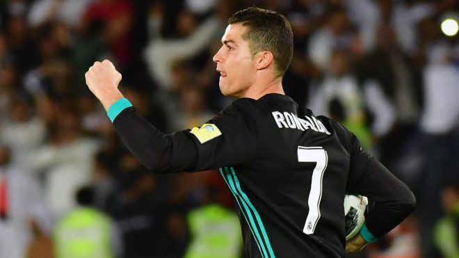 Real Madrid's Portuguese forward Cristiano Ronaldo celebrates after scoring his team's equaliser during the FIFA Club World Cup semi-final match in the Emirati capital Abu Dhabi on December 13, 2017. GIUSEPPE CACACE / AFP