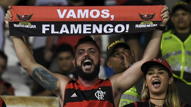 Fans of Brazilian team Flamengo cheer for their team before the start of the Copa Sudamericana semifinal second leg football match against Colombian Junior, at the Roberto Melendez stadium in Barranquilla, Colombia, on November 30, 2017. Luis ACOSTA / AFP
