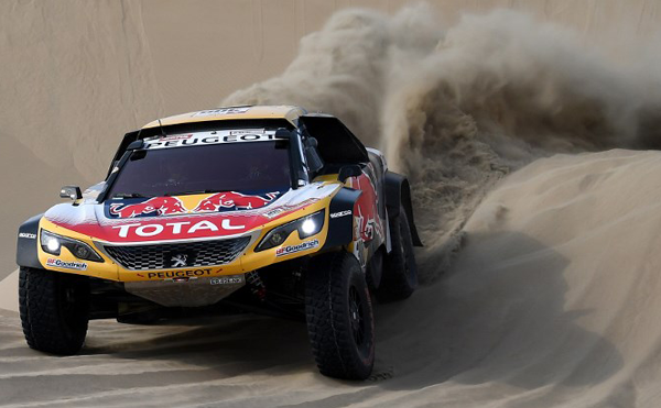 Peugeot's driver Stephane Peterhansel and his co-driver Jean Paul Cottret of France compete during Stage 3 of the Dakar 2018 between Pisco and San Juan de Marcona, Peru, on January 8, 2018. FRANCK FIFE / AFP