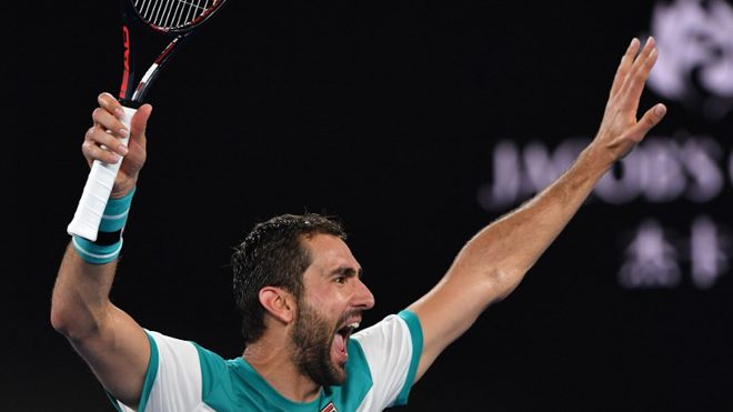 Croatia's Marin Cilic celebrates beating Britain's Kyle Edmund in their men's singles semi-finals match on day 11 of the Australian Open tennis tournament in Melbourne on January 25, 2018. Paul Crock / AFP