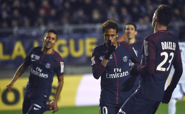 Paris Saint-Germain's Brazilian forward Neymar (L) celebrates after scoring a penalty kick during the French League Cup quarter-final football match between Amiens (ASC) and Paris Saint-Germain (PSG) at the Licorne Stadium in Amiens, northern France, on January 10, 2018. FRANCOIS LO PRESTI / AFP