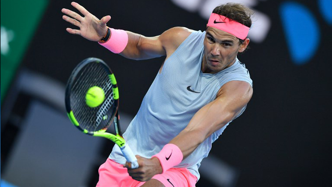 Spain's Rafael Nadal hits a return against Dominican Republic's Victor Estrella Burgos during their men's singles first round match on day one of the Australian Open tennis tournament in Melbourne on January 15, 2018. Greg Wood / AFP