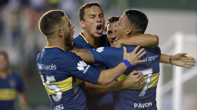 Boca Juniors' forward Carlos Tevez (2nd-R) celebrates with teammates after scoring a goal against Banfield during their Argentina First Division Superliga football match at Florencio Sola stadium, in Banfield city, near Buenos Aires, on February 18, 2018. Pablo Aharonian / AFP